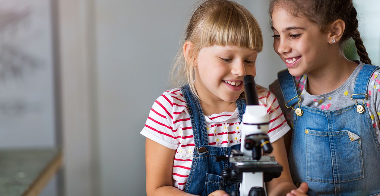 Girls looking at microscope